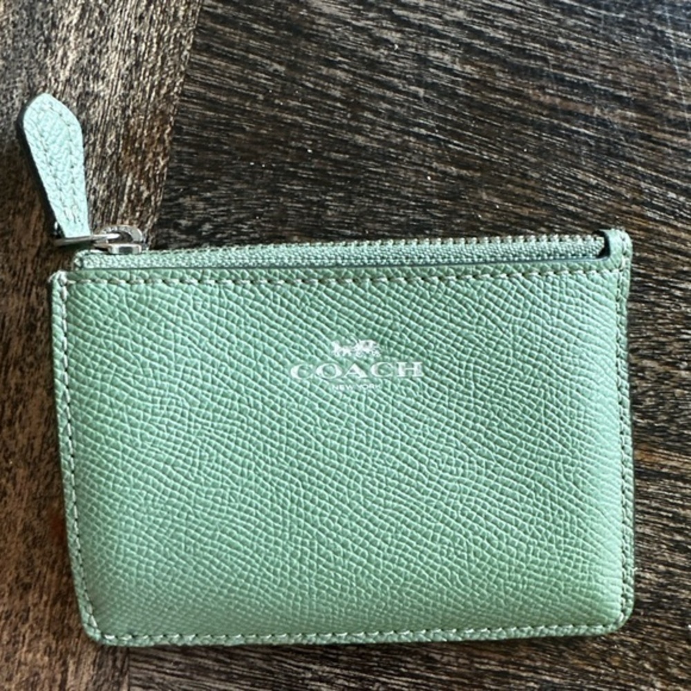 Coach Green and Black Leather Keychain Wallet has a little damage in the photos